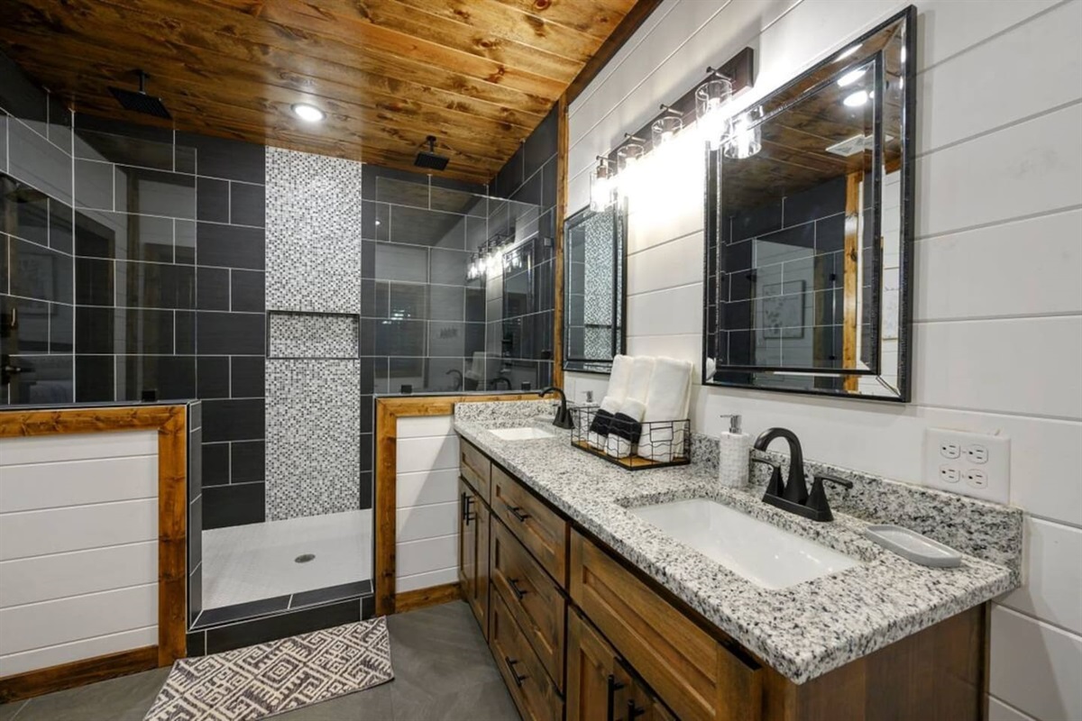 Enjoy forest-inspired serenity even in the bath, with clean tile finishes and fresh linens.
