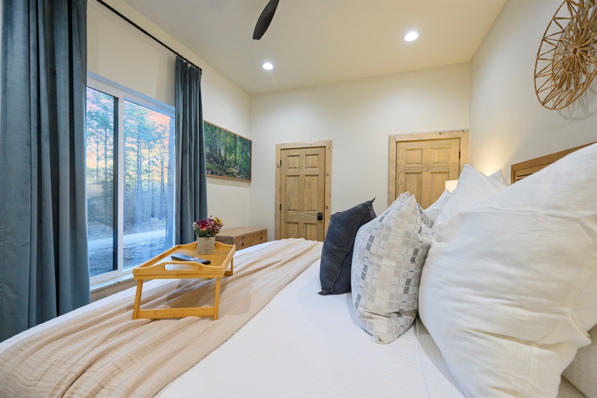 Peaceful king bedroom with forest views 🌲
