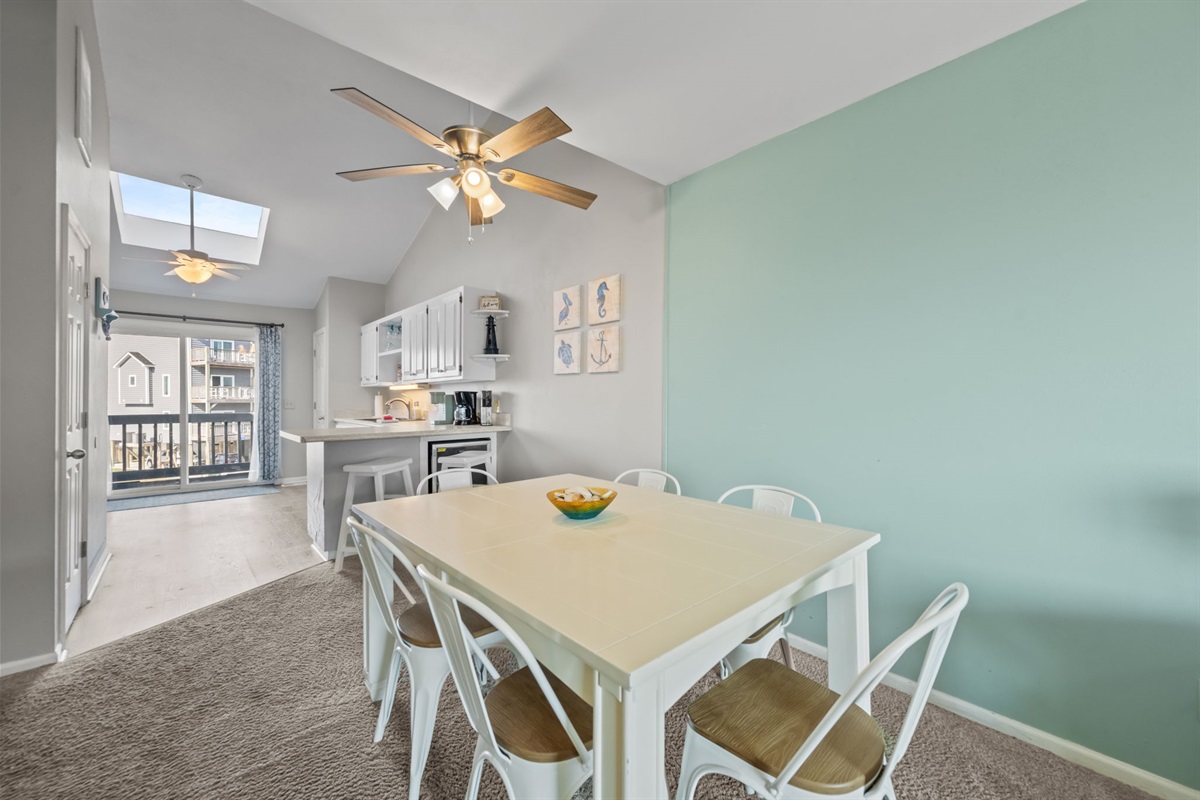 Bright dining space beside the kitchen with seating for everyone, perfect for slow breakfasts before heading out to the sand