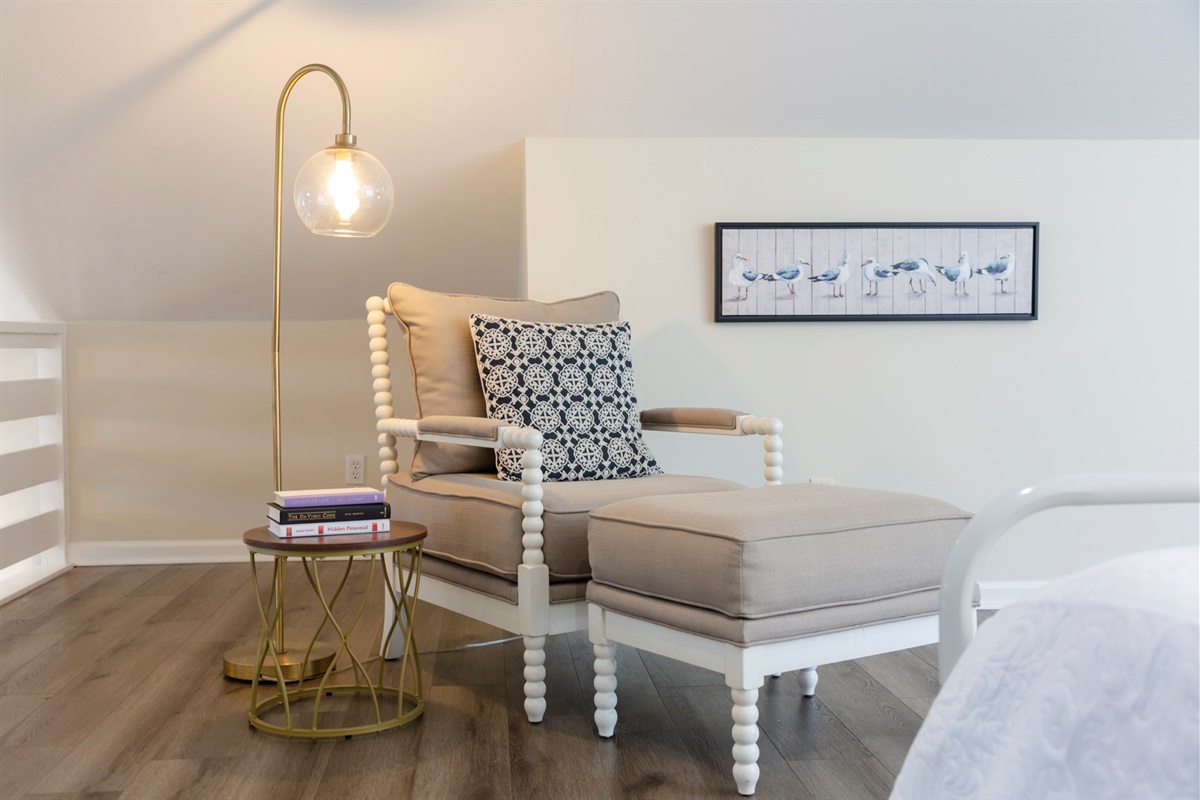 Cozy chair and natural light create the perfect spot to unwind upstairs.