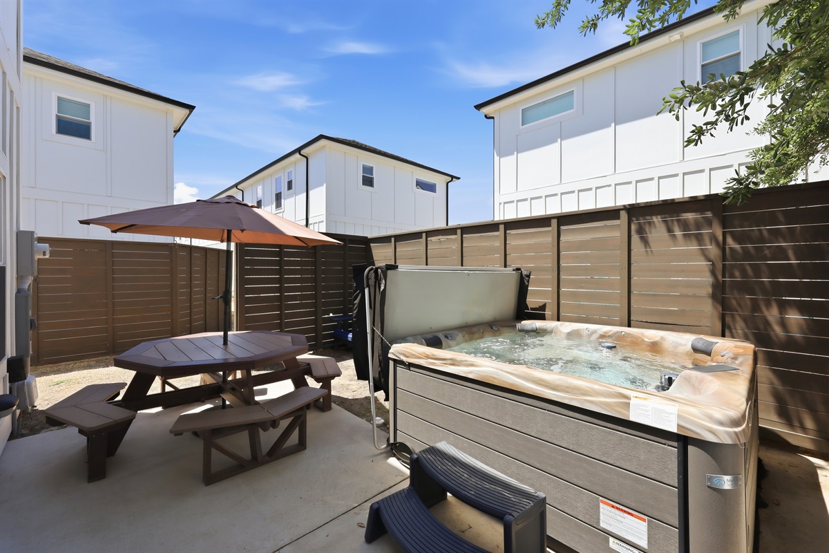 Relax in the hot tub after a beach day