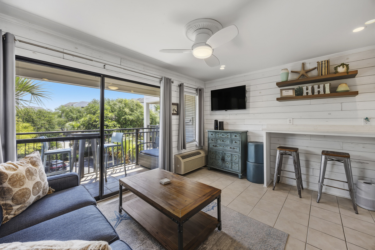 Open concept living with ocean view, smart TV, and bar height dining