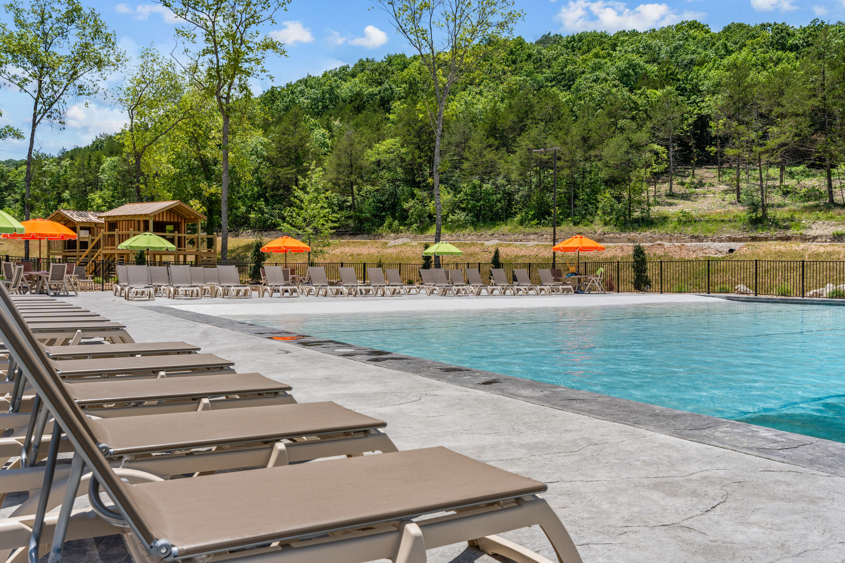 Soak up the Branson sunshine at the zero-entry outdoor resort pool, with loungers just steps from your cabin.