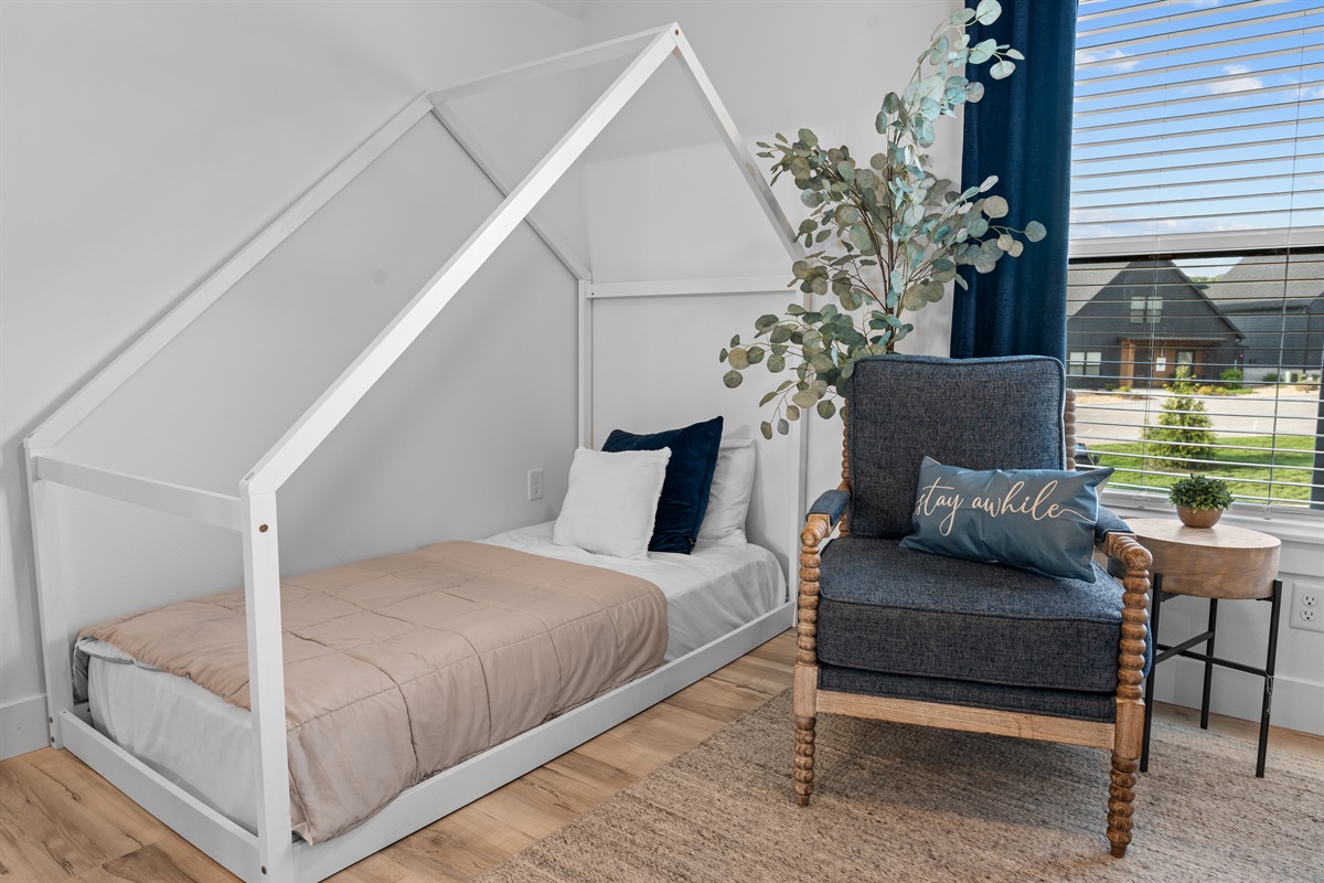 Bedroom 4 has an additional twin bed and a great sitting area with lots of natural light