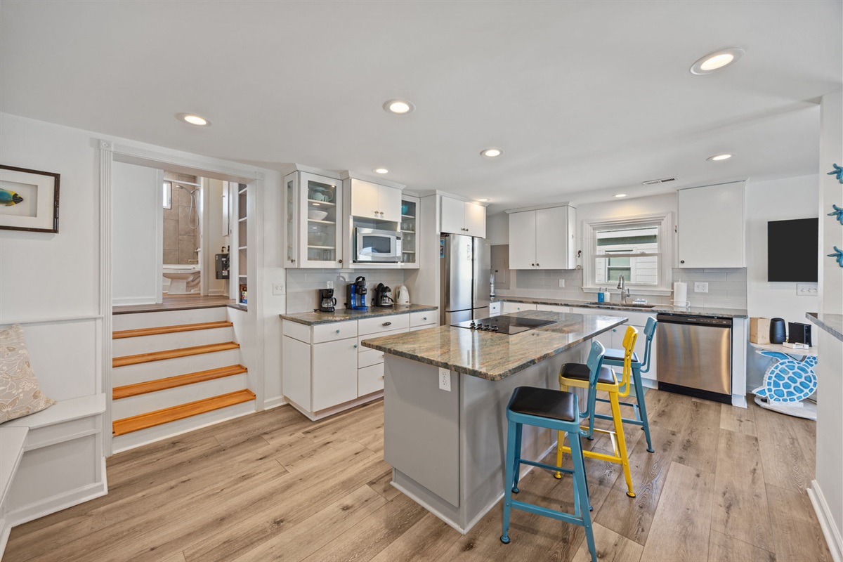 Spacious island with seating, perfect for casual meals, coffee, or keeping the cook company