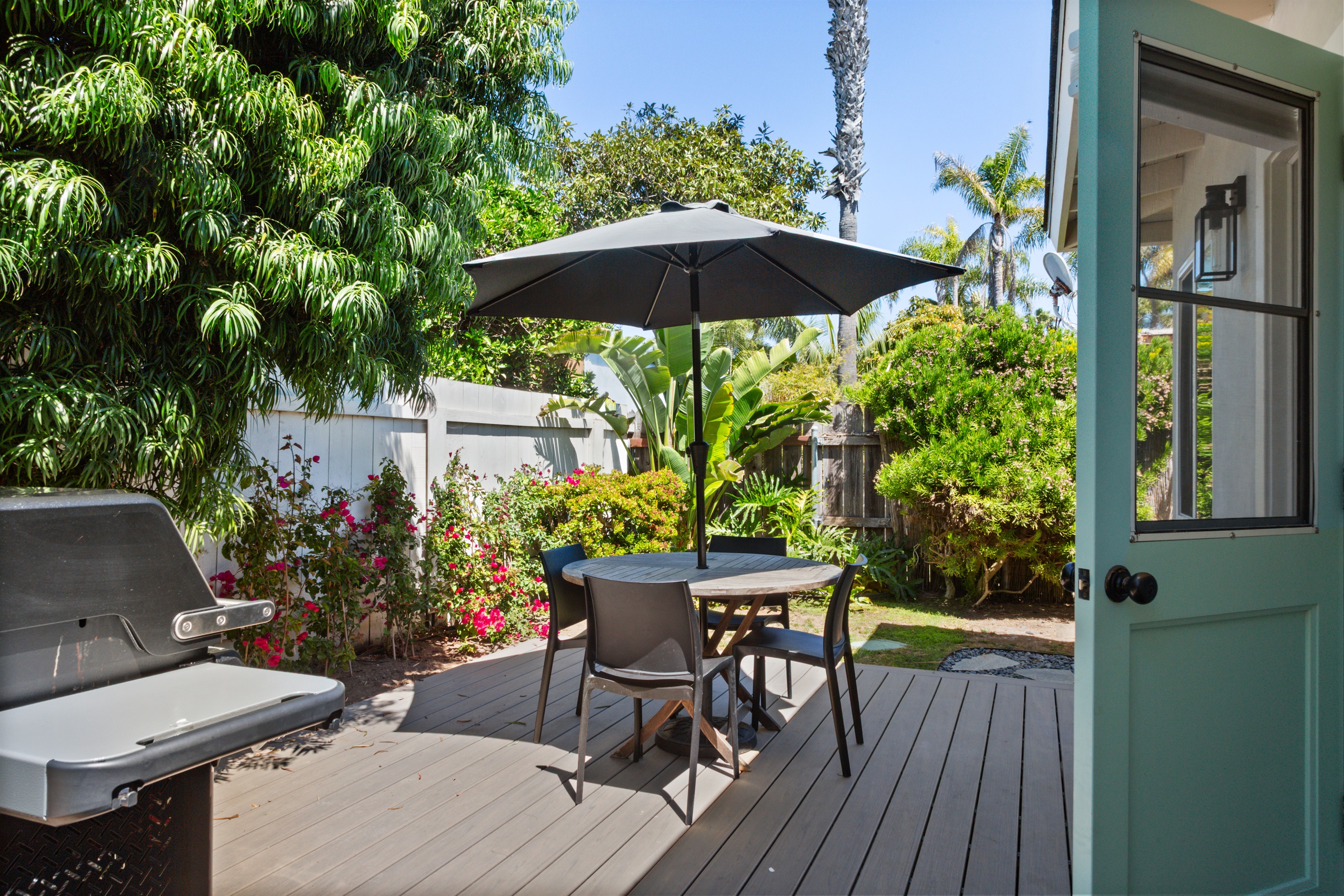 Lush private/gated patio off the kitchen