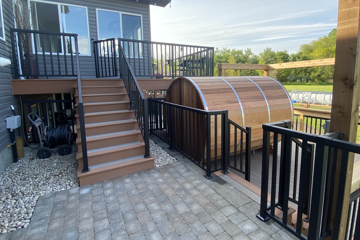 STAIRS TO GUEST ENTRANCE. 3 WAY LIGHT SWITCH FOR COURT YARD ON WOOD POST.
