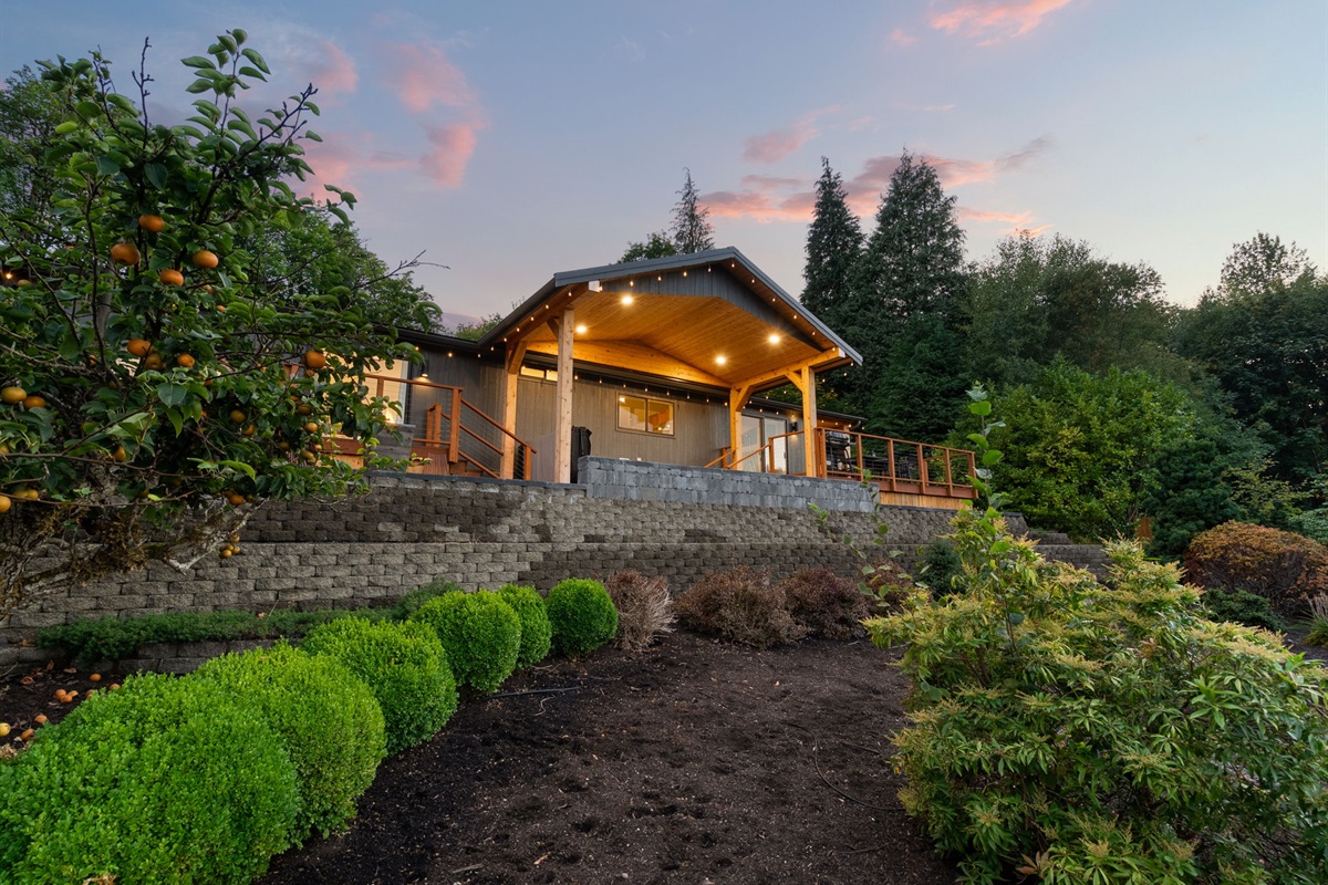 Soft twilight wraps the home and surrounding landscape in a tranquil embrace