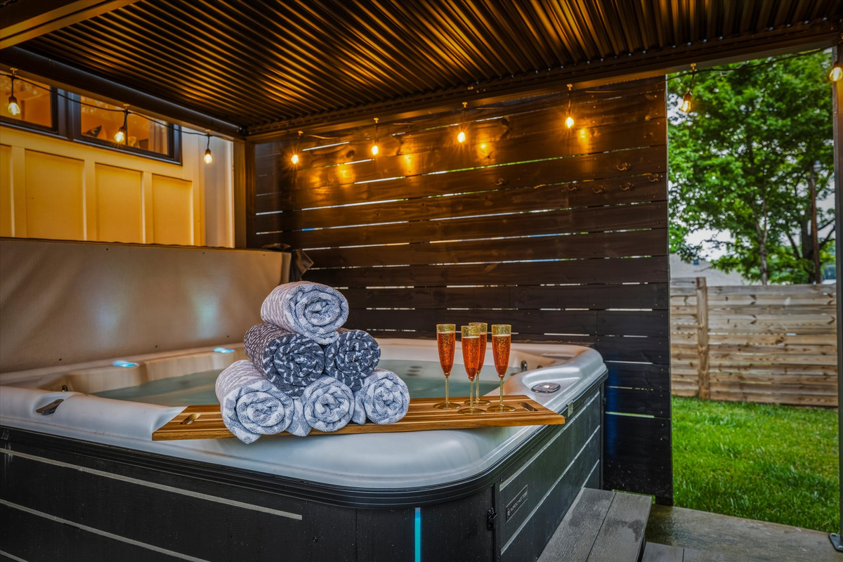 Soak in the covered hot tub rain or shine.