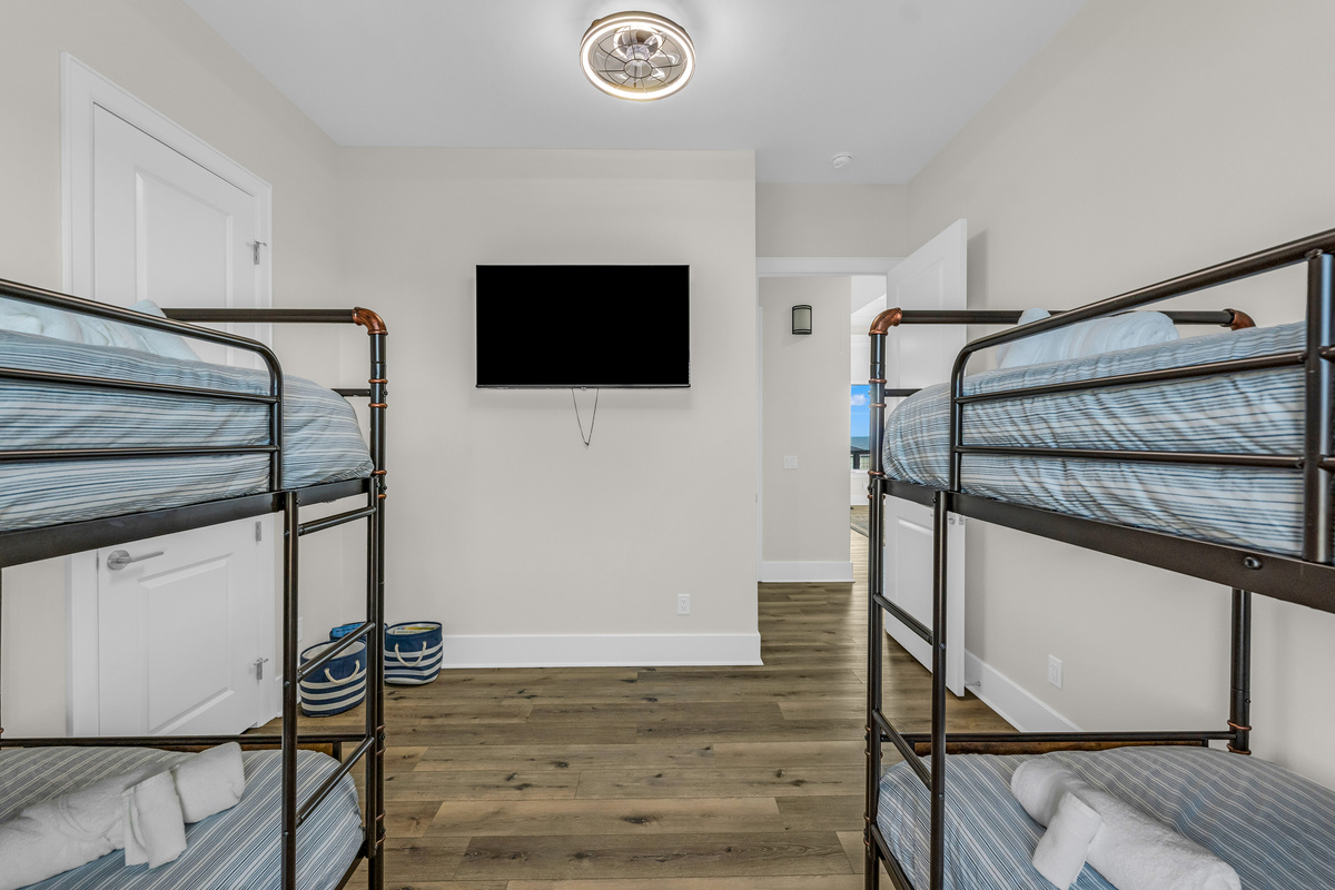 Costa Cristal Bedroom 4: A bright and welcoming bunk room designed for both comfort and convenience, offering a fun and cozy space perfect for kids or additional guests.