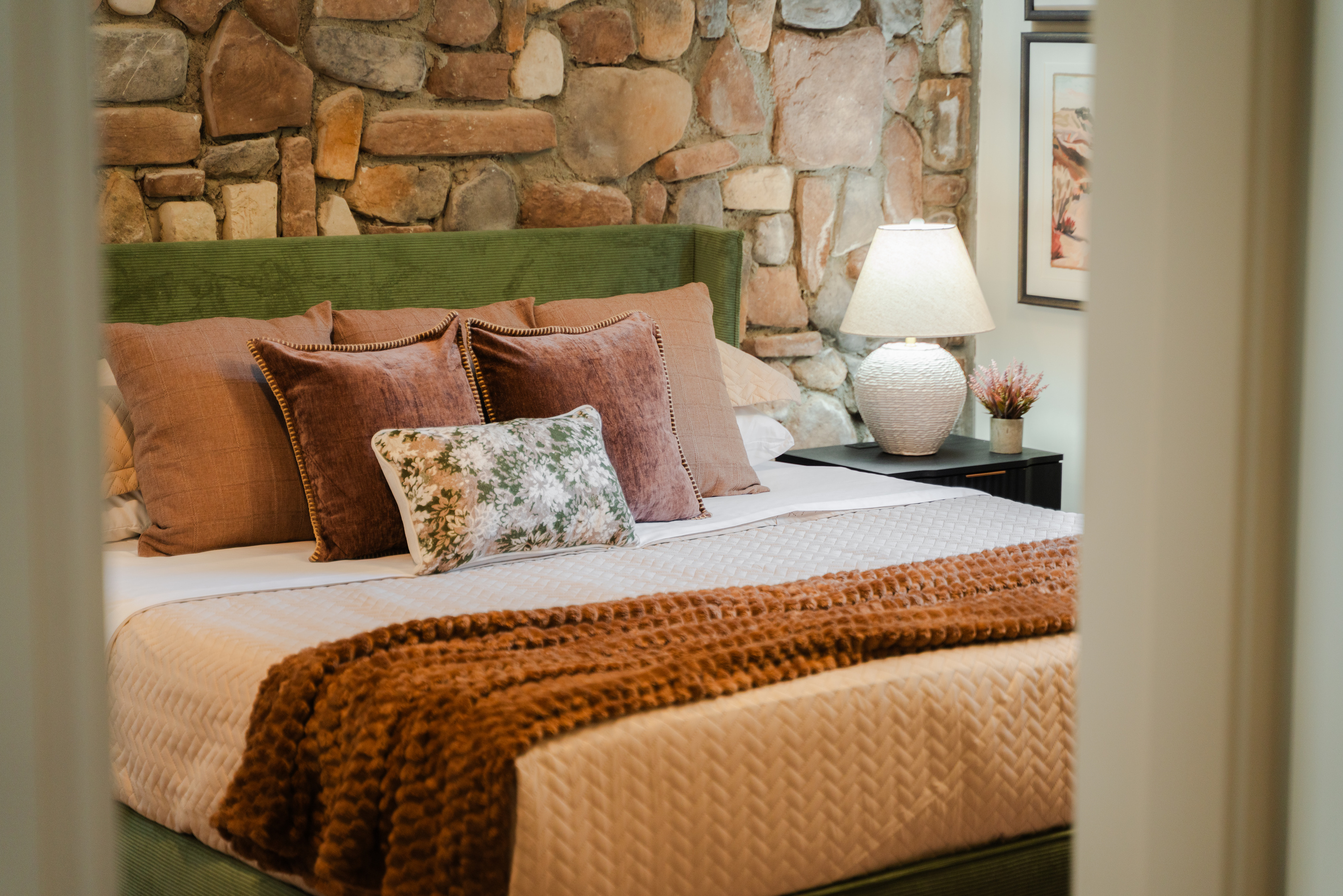 Warm, relaxing bedroom with an upscale modern-cabin feel.