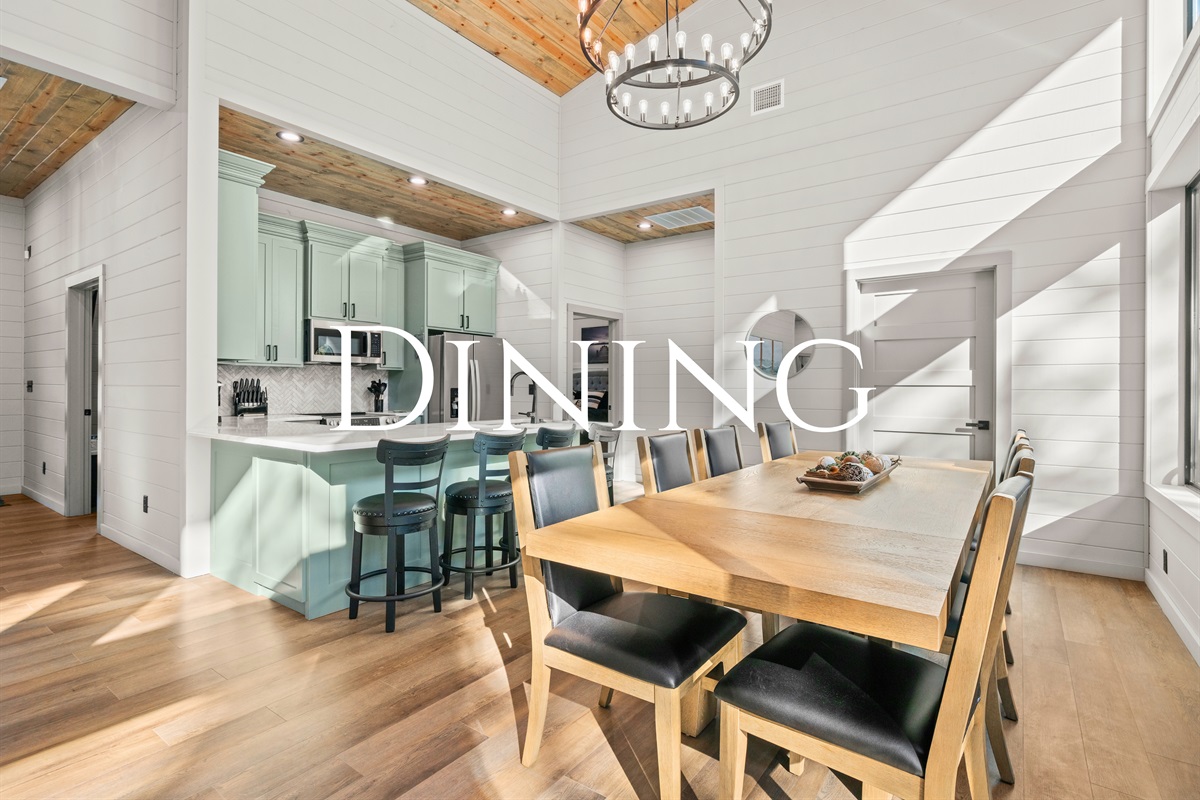 The dining area offers a warm, welcoming space to gather for shared meals, game nights, or long conversations that stretch into the evening.