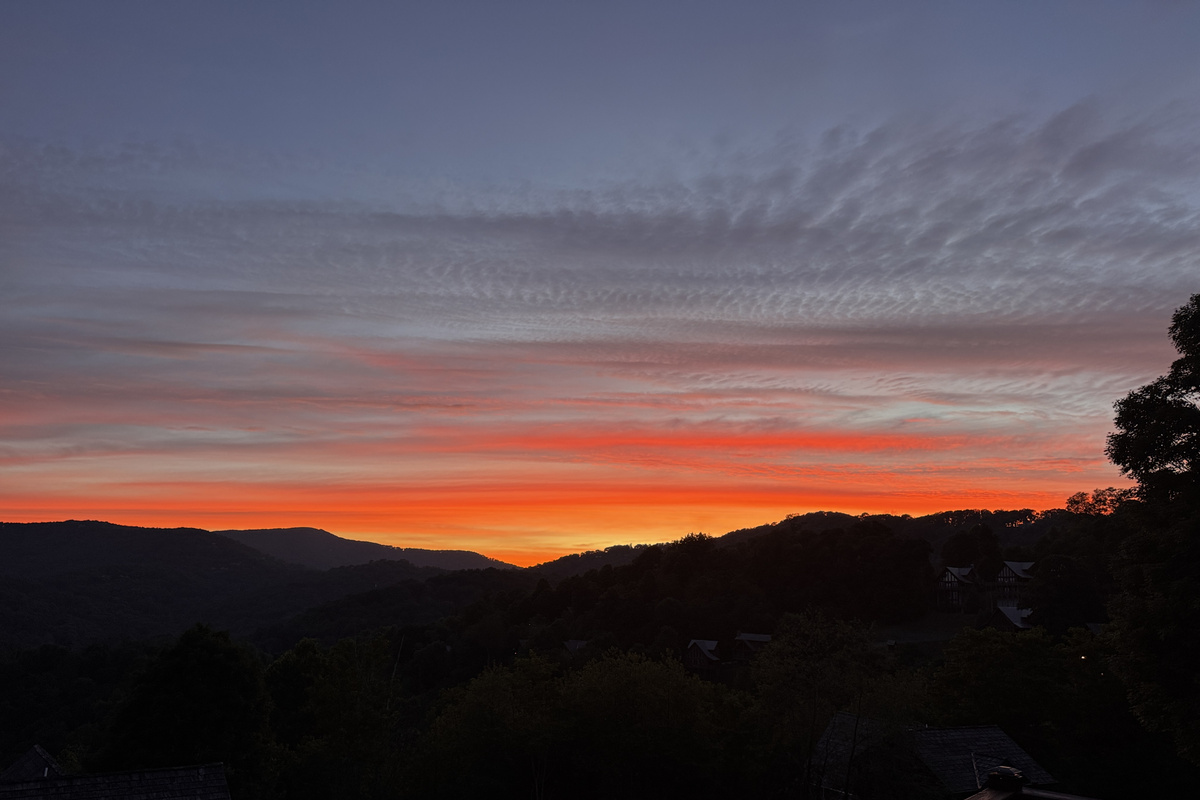 Morning light over the mountains toward Big Bald — one of the peaceful long-range views guests can enjoy from the property.