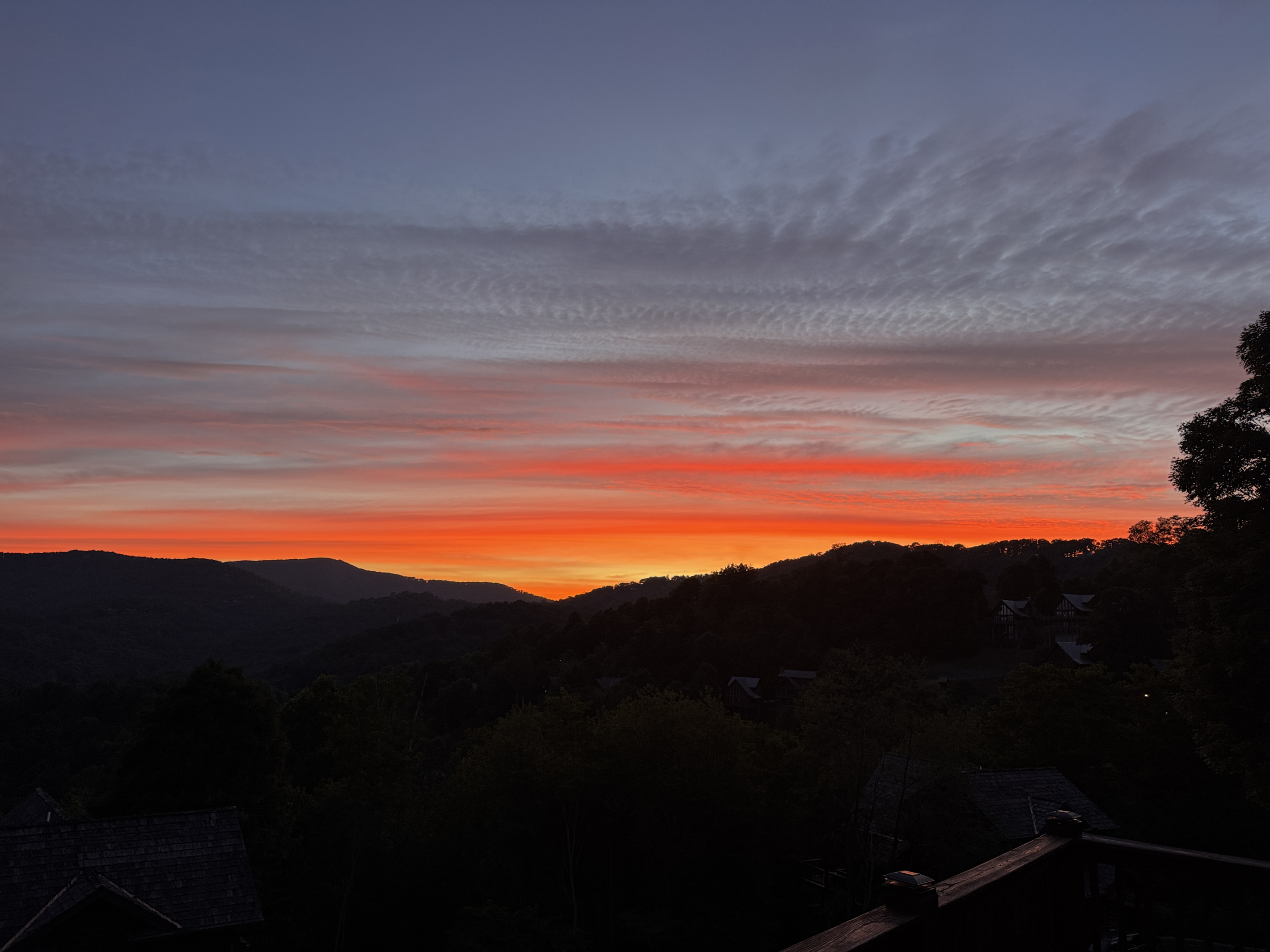 Morning light over the mountains toward Big Bald — one of the peaceful long-range views guests can enjoy from the property.