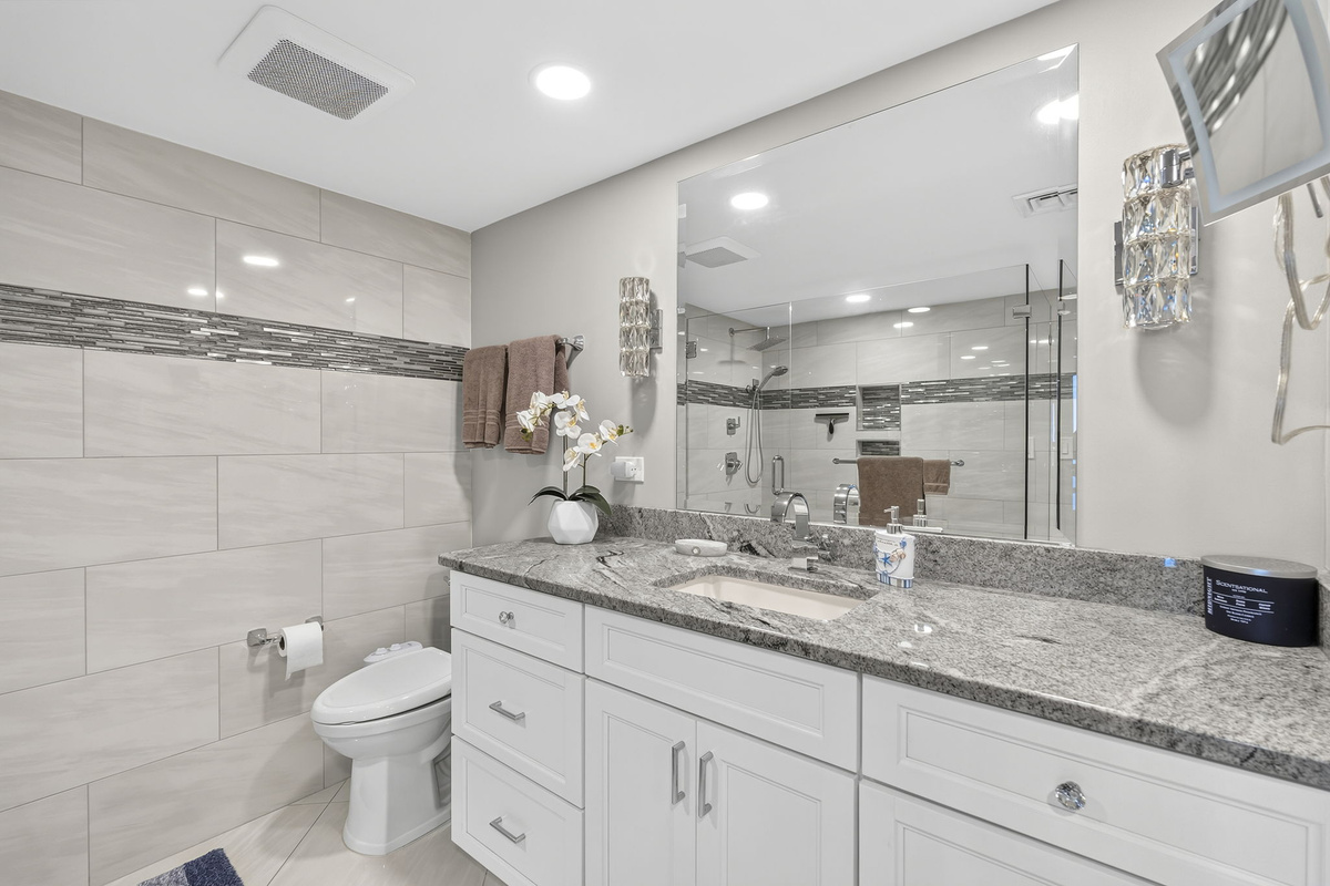 Ensuite Bathroom with walk in shower, bidet, granite vanity and more