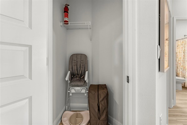 Hall Closet with baby items and fire extinguisher