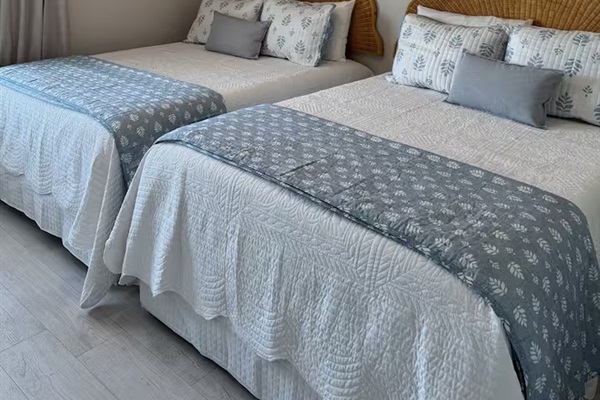 Bedroom 4 has 2 double beds. Bed linens. Clothing storage. Hangers. Room-darkening shades. 