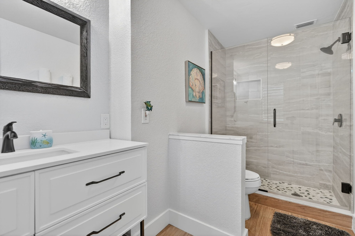 Bathroom with vanity and walk-in shower