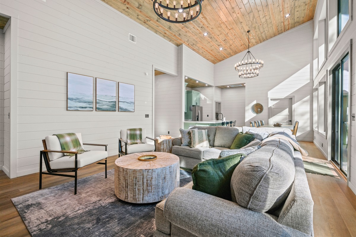 Expansive windows, high ceilings, and soft tones create a bright and airy atmosphere that feels both elegant and comfortable.