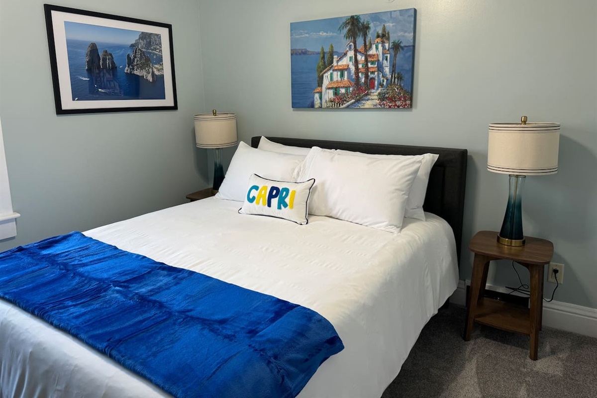The Upper Level Capri Room offers Queen bed and Roku smart TV in a calm and relaxing setting.
