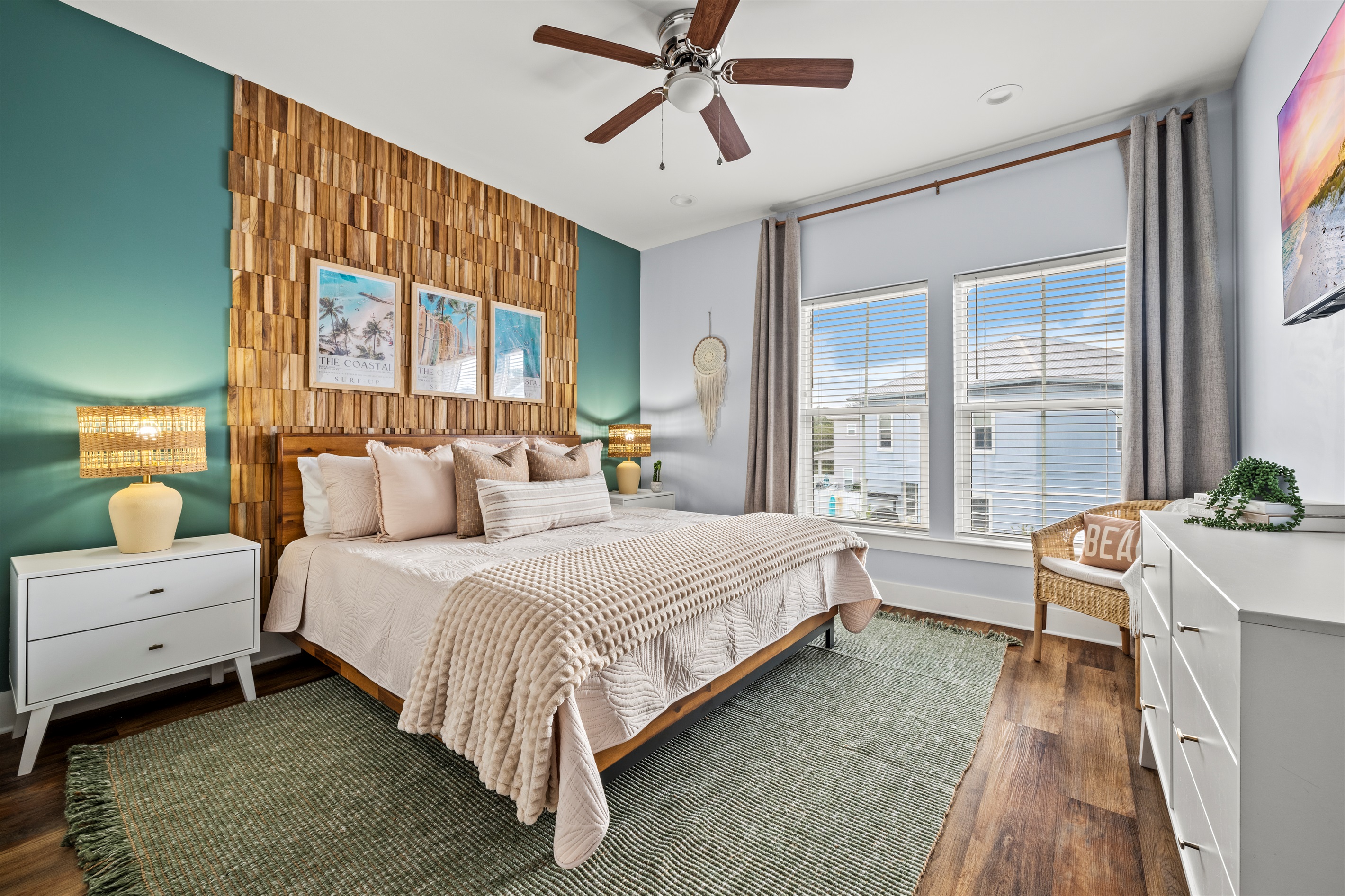 A stunning coastal retreat with a beautiful wood feature wall and soft textures throughout. The perfect bedroom for restful nights during your Destin getaway.