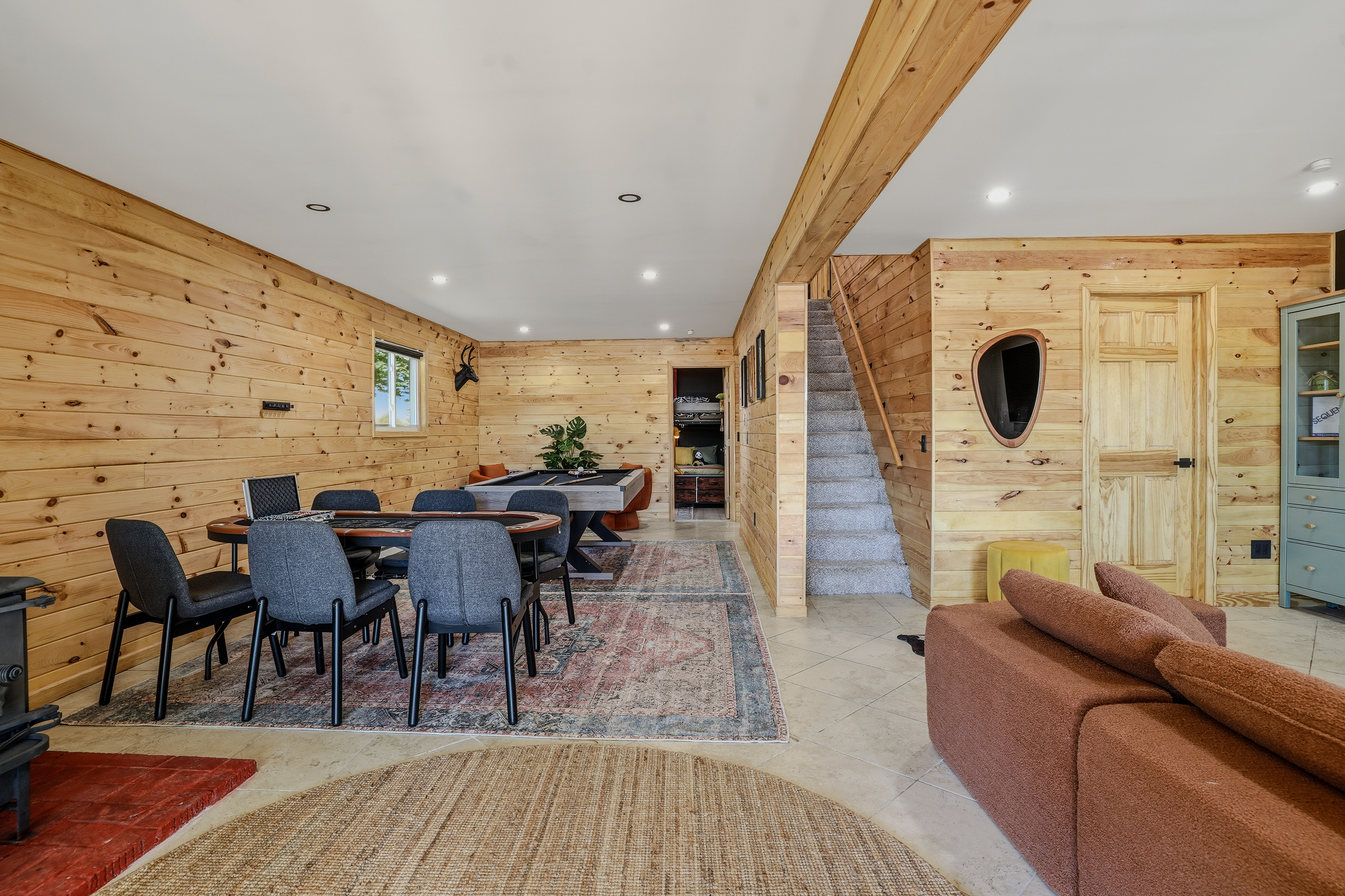 Game room — pool table, dining area, and wide open floor plan for the whole group