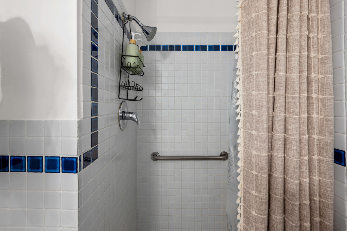 Enjoy a refreshing shower in this beautifully updated guest bathroom.