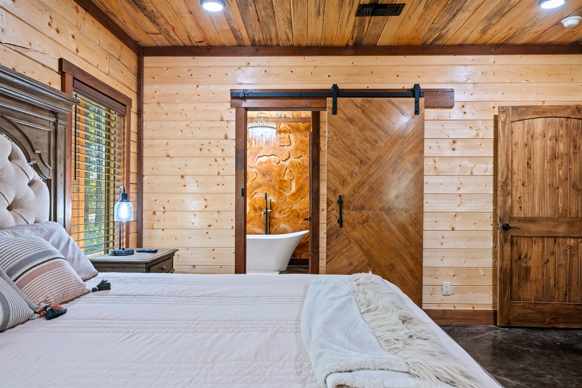 Serene bedroom retreat with sliding barn door detail.