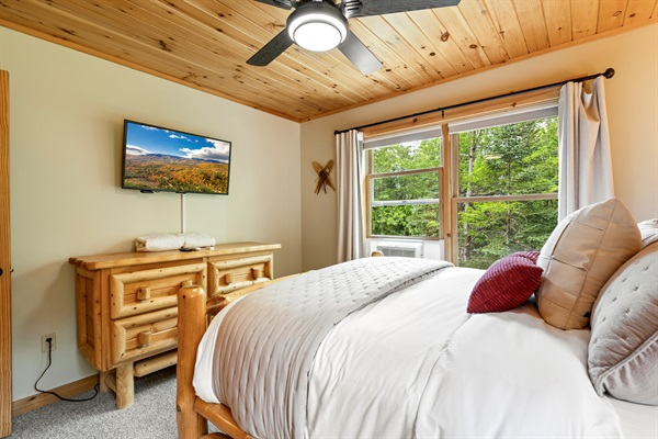 Stay cool and entertained with a ceiling fan and TV right in the room