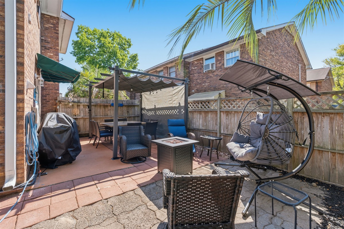 Enjoy the private out door space with plenty of seating, a gas grill and fenced yard.  