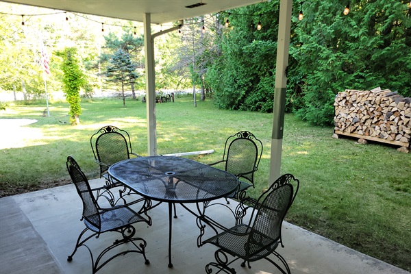 Main Porch: covered, seating for 6+, charcoal grill, string lights, close to the fire pit