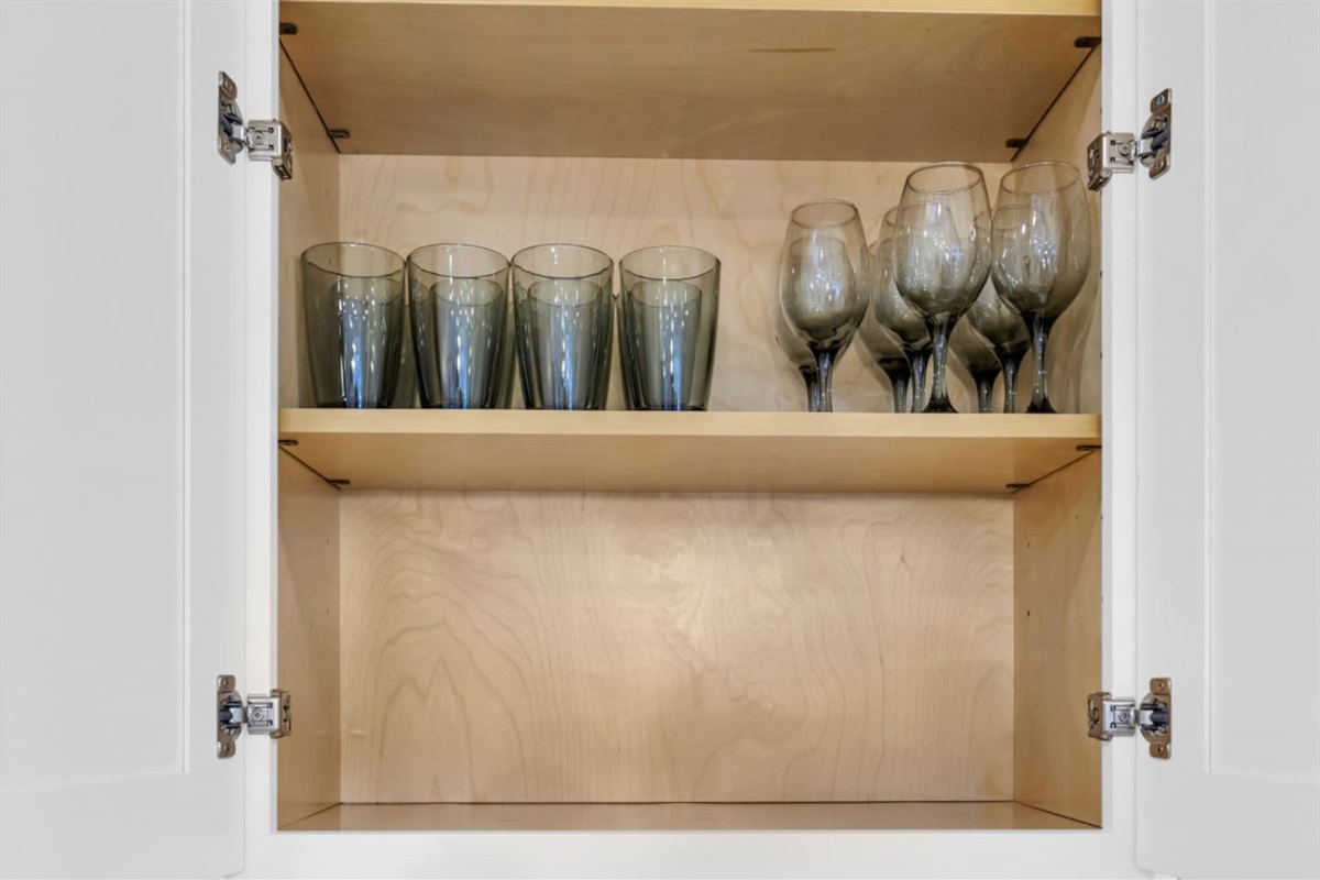 Neatly arranged wine glasses and drinkware, ideal for relaxed evenings at home. Everything you need is provided for a seamless stay.