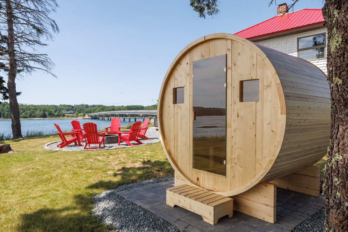 Sweat it out in the barrel sauna, then step straight into the cool tidal bay — the Scandinavian ritual, Maine edition.