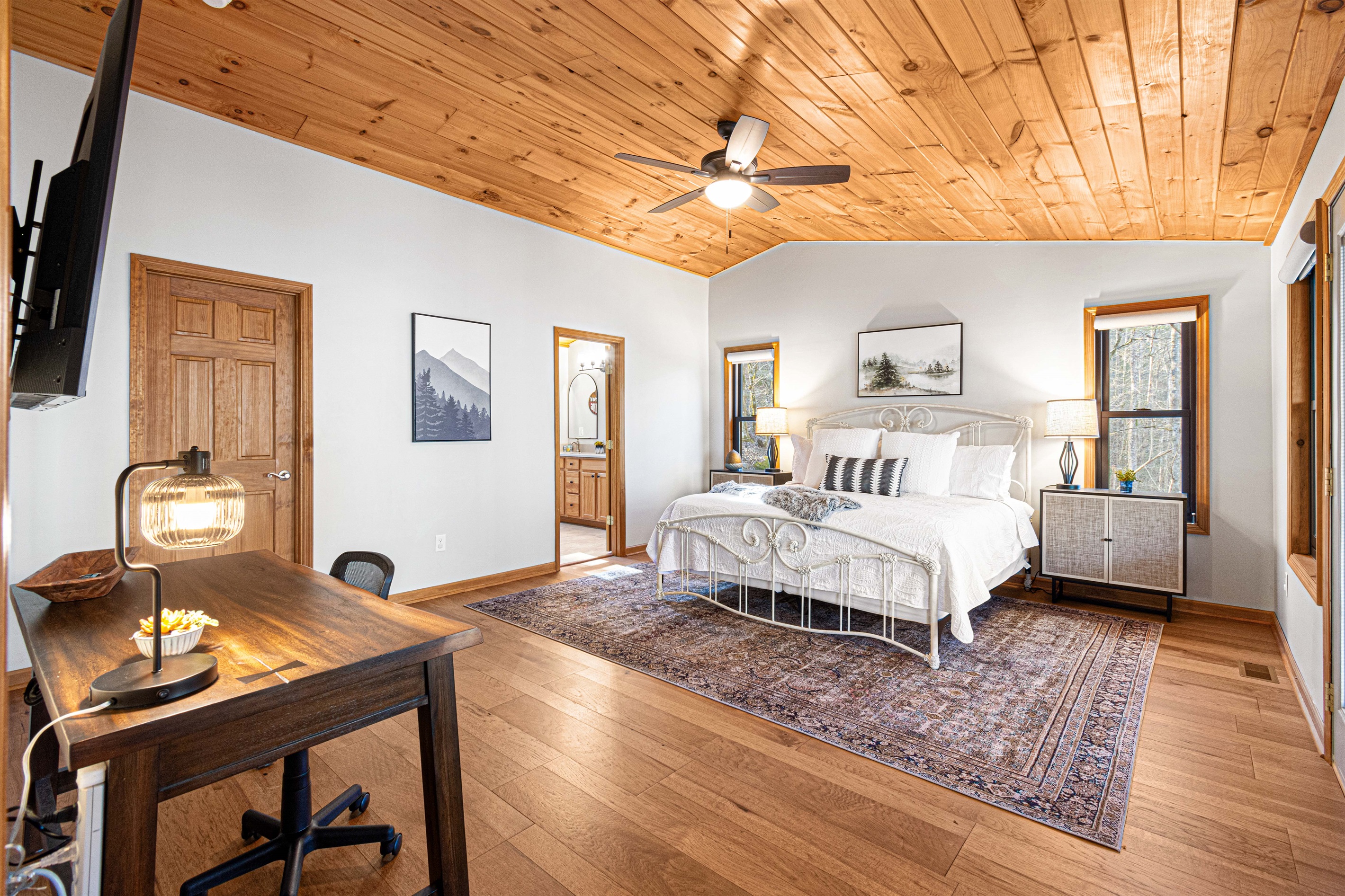 Large primary bedroom with a work space just in case *gasp* you have to work.