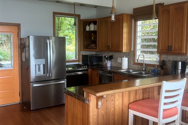 Well-stocked kitchen with updated appliances.