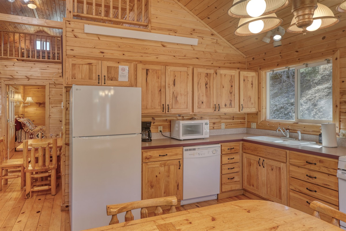 Kitchen with oven, stove, microwave