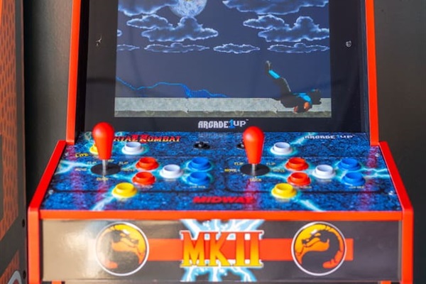 Arcade Throwback Fun  – Relive the excitement with a classic Mortal Kombat II arcade machine.