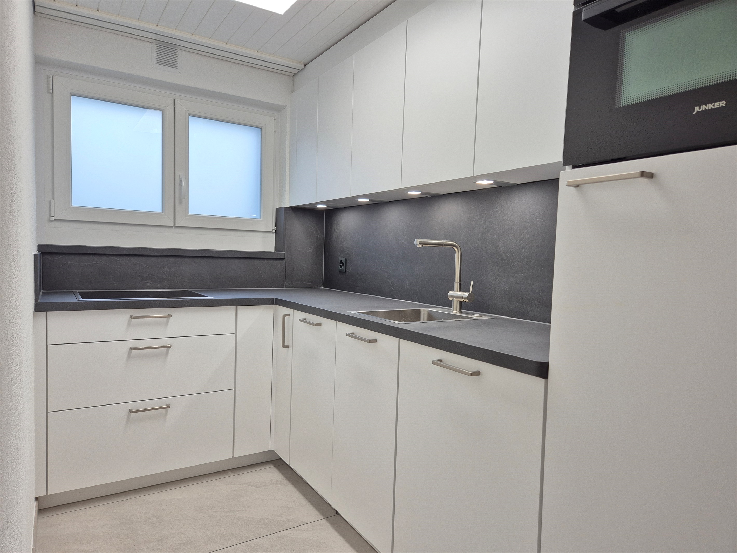 Fully equipped kitchen with washer, dryer, dishwasher, oven, fridge, microwave, coffee maker, kettle, toaster and induction hob