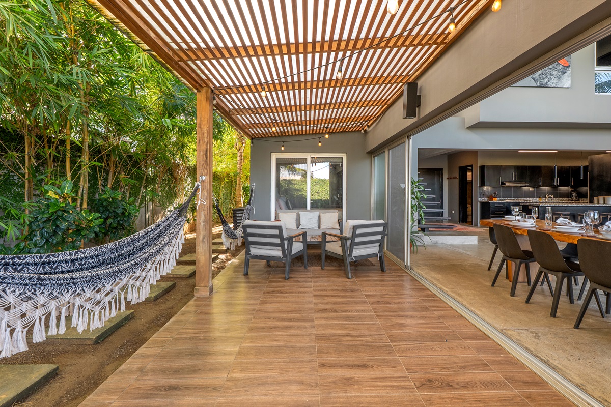 Outdoor patio with a relaxing hammock.