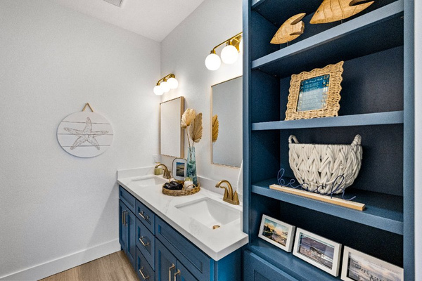 Murdoch's beautiful coastal bathroom with double vanity and large shower.