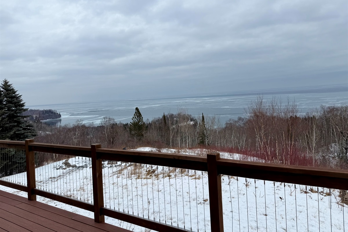 As you step on the deck the 180° Lake Superior panorama view shines, with the fire pit and chairs below, ready for sunrises, s’mores, and fresh lake air.