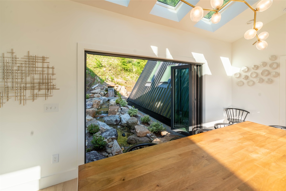 Dining Room w/ Doors Open to Water Feature