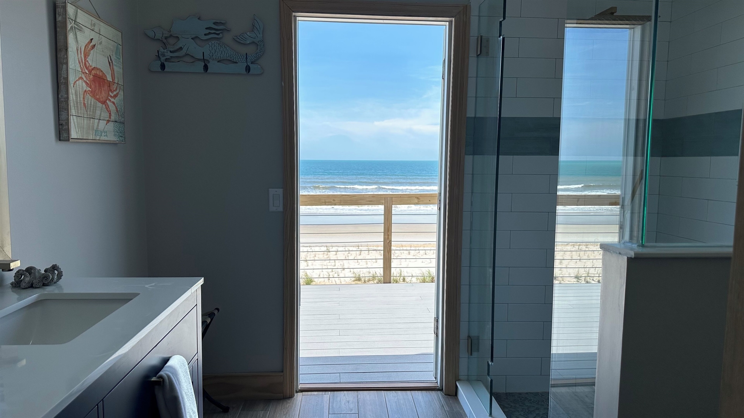 Come in from the beach and rinse off through the hallway bathroom
