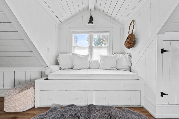 Two XL Twin beds in window dormers.  All the extra bedding needed right below for chilly nights. 