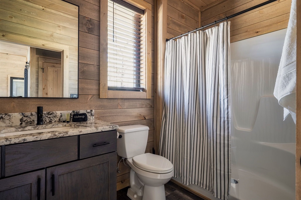 A huge shower with seating just outside Bedroom #2 on the main level