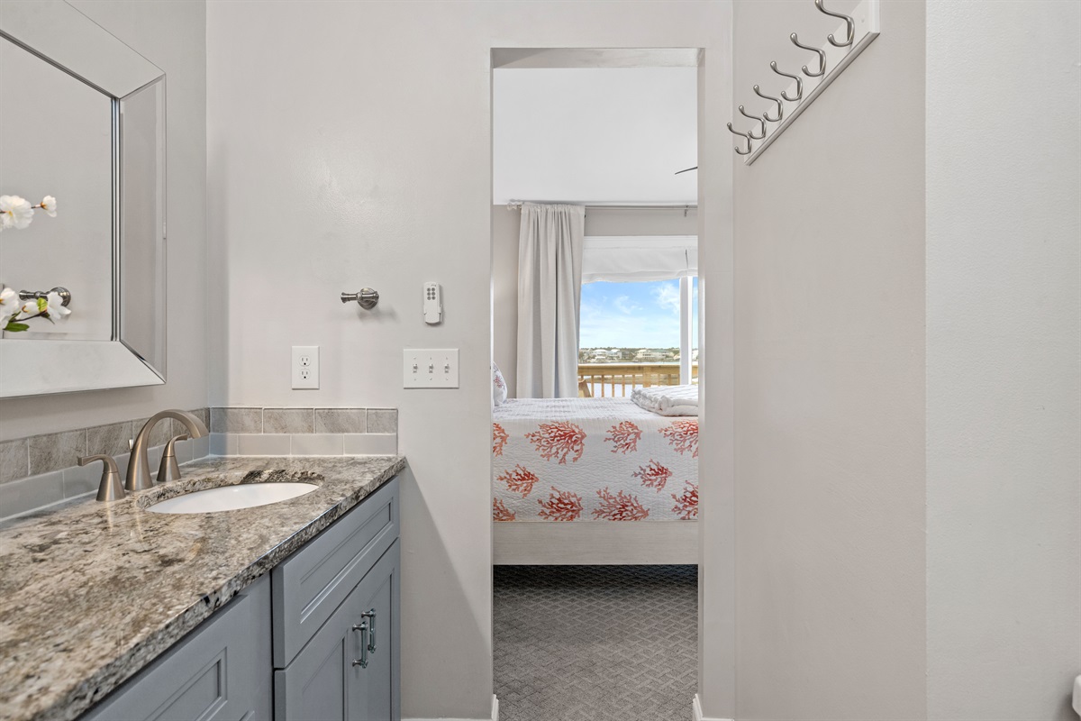 Ensuite bathroom with double vanity and direct access to queen bedroom