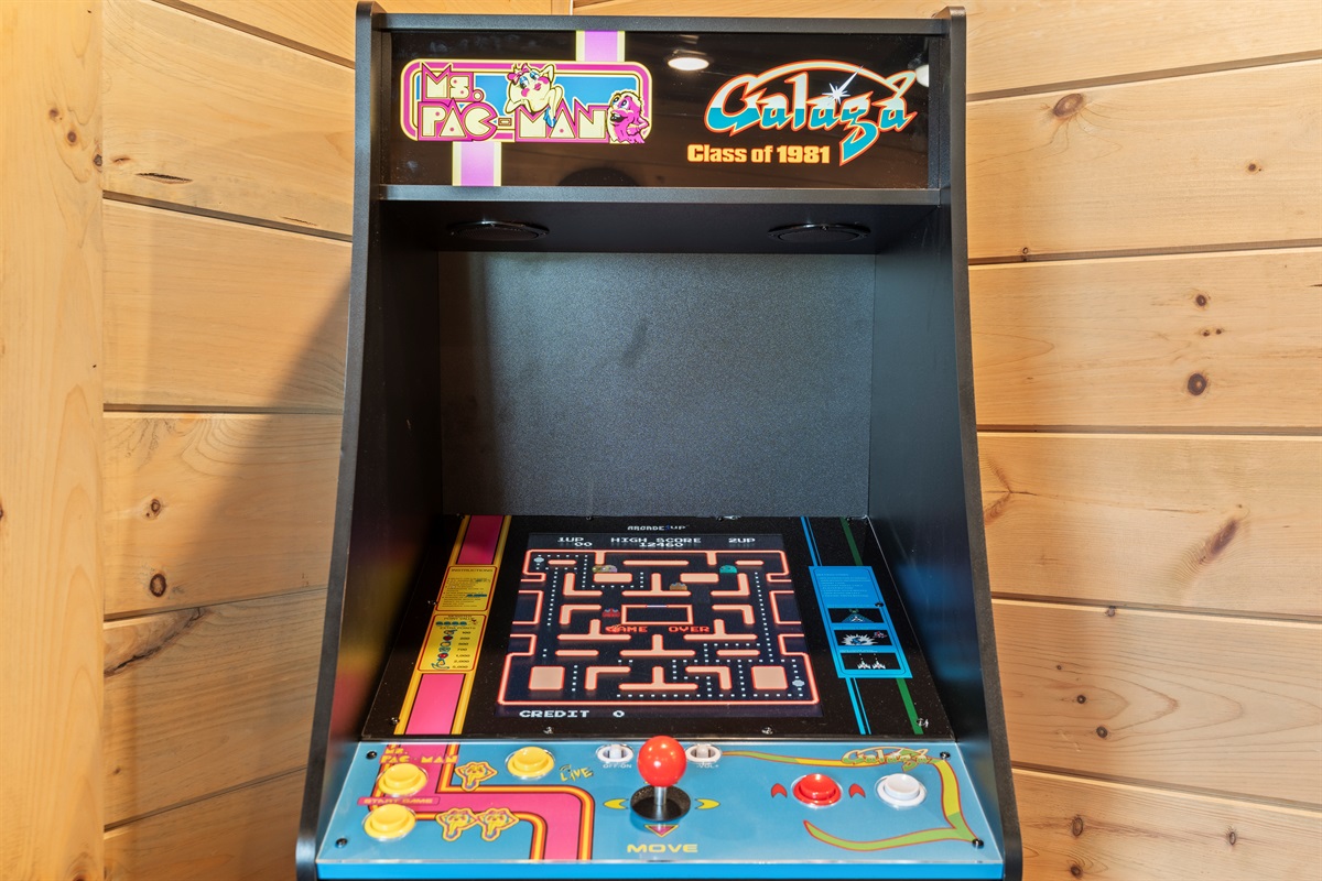 Level up your stay with a dose of nostalgia! Featuring a classic Ms. Pac-Man arcade game, 65" smart TV, this cozy game room is the perfect hangout for guests of all ages.