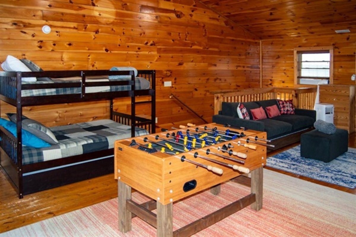 Give kids their own fun zone with bunk beds, foosball, and space to play while adults relax nearby.