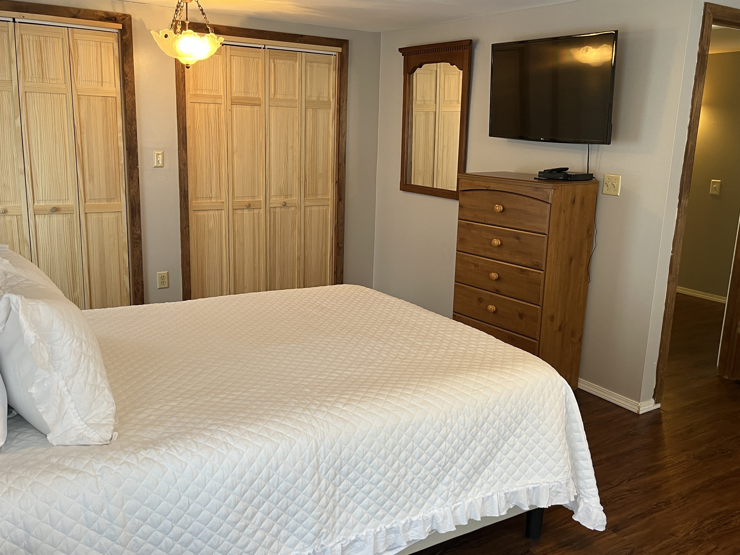 Primary bedroom with Queen and SmartTV