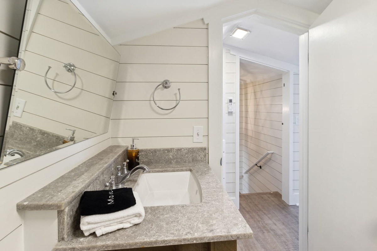 The loft ensuite bath &mdash; stylish, fully equipped, and yours alone at the top of the home.